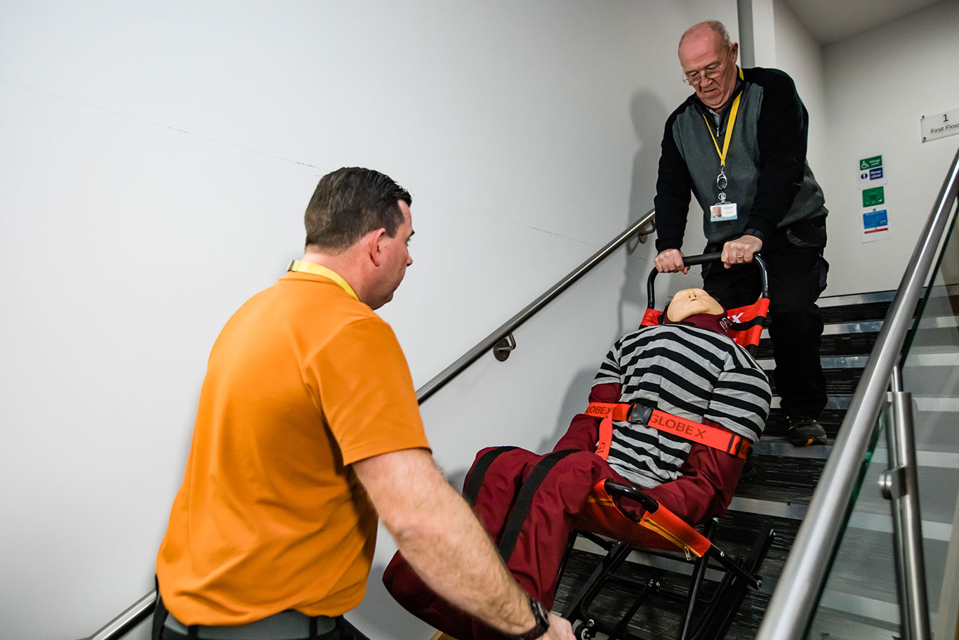 Evacuation chair training on a stairwell with a training mannequin